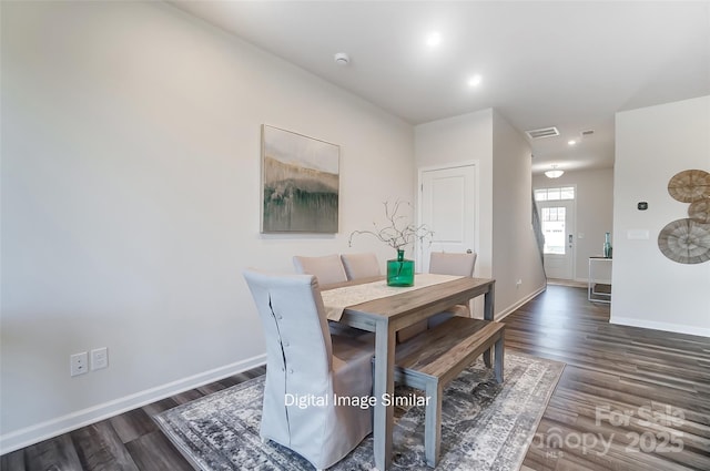 dining area featuring dark hardwood / wood-style flooring