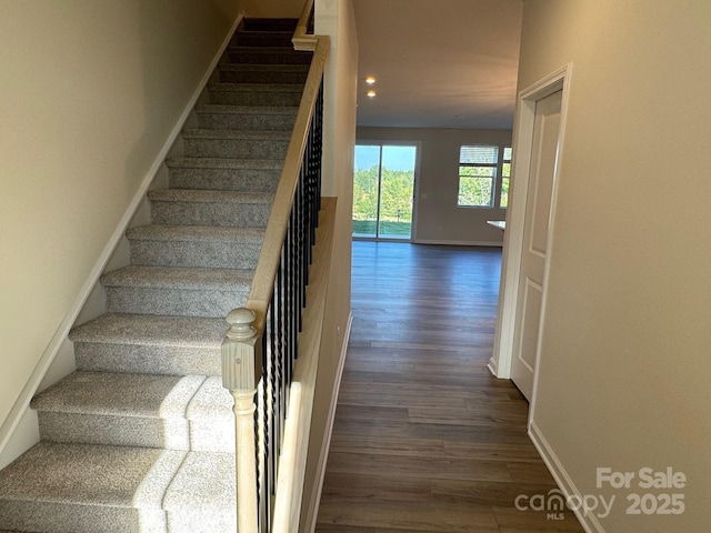 stairs with wood-type flooring