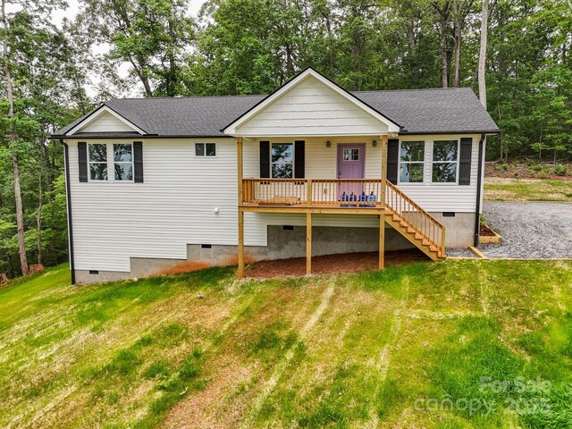 474 Hague Dr, Columbus, NC 28722 - single story home featuring crawl space, a front lawn, stairway, and view of scattered trees