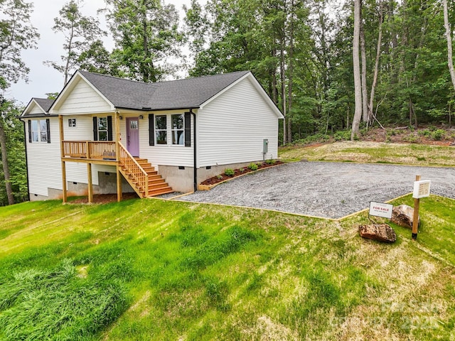 474 Hague Dr, Columbus, NC 28722 - view of front of house with crawl space, driveway, a front lawn, and a shingled roof