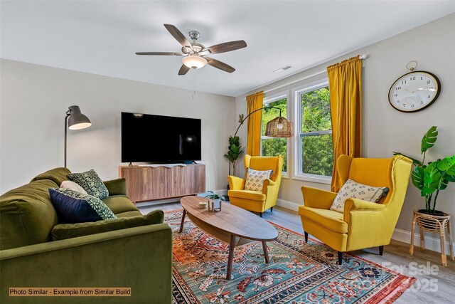 474 Hague Dr, Columbus, NC 28722 - living room with a ceiling fan, wood finished floors, and baseboards