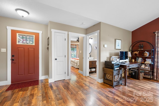 entrance foyer featuring ceiling fan and hardwood / wood-style flooring