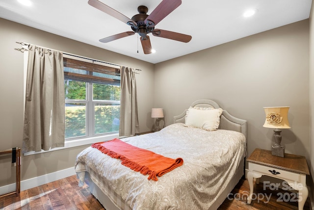 bedroom featuring ceiling fan and dark hardwood / wood-style flooring