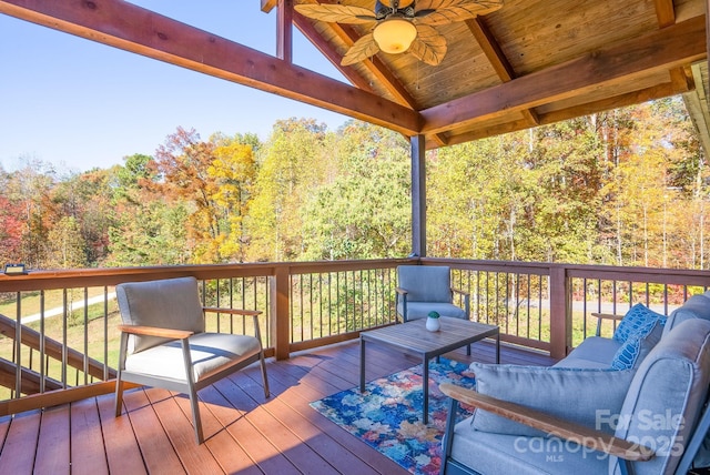 wooden deck featuring ceiling fan