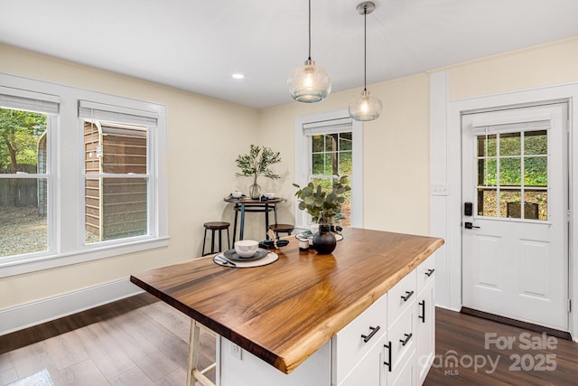 office space with dark wood-type flooring