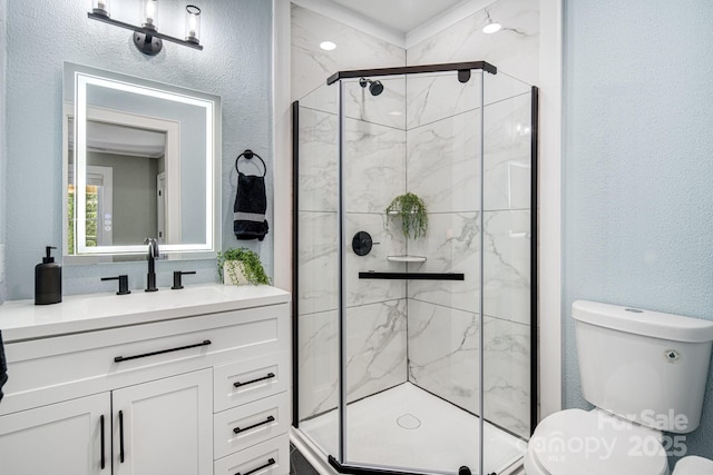 bathroom with vanity, toilet, and walk in shower