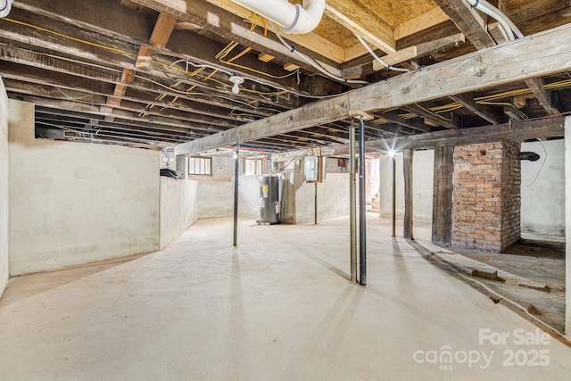 basement with electric panel and water heater