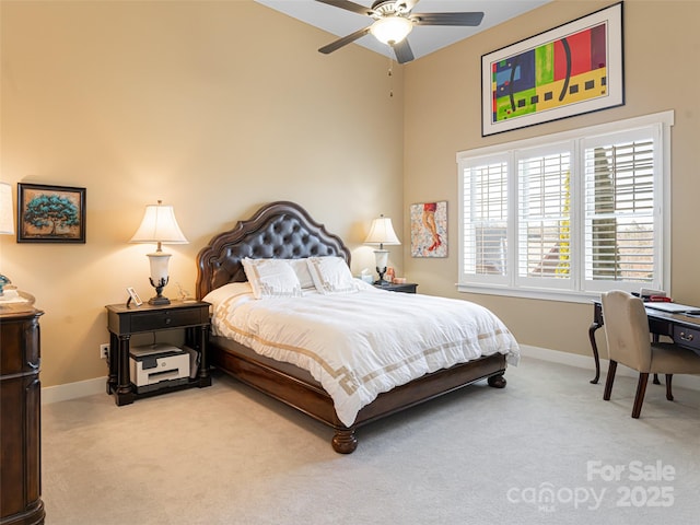 bedroom featuring ceiling fan and light carpet