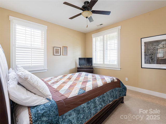 bedroom with ceiling fan and carpet floors