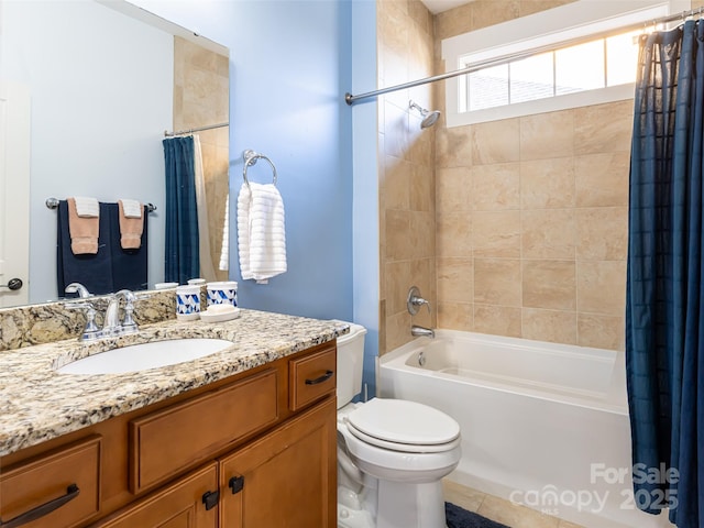 full bathroom featuring toilet, vanity, and shower / tub combo with curtain