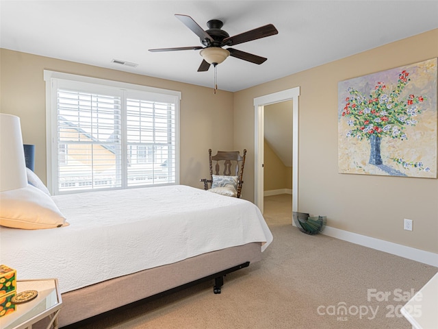 bedroom with ceiling fan and carpet