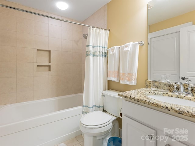 full bathroom with tile patterned flooring, shower / bath combo, vanity, and toilet