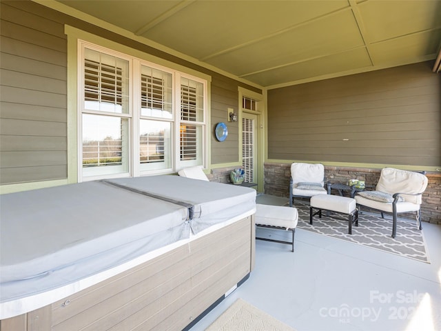 view of patio / terrace with a hot tub