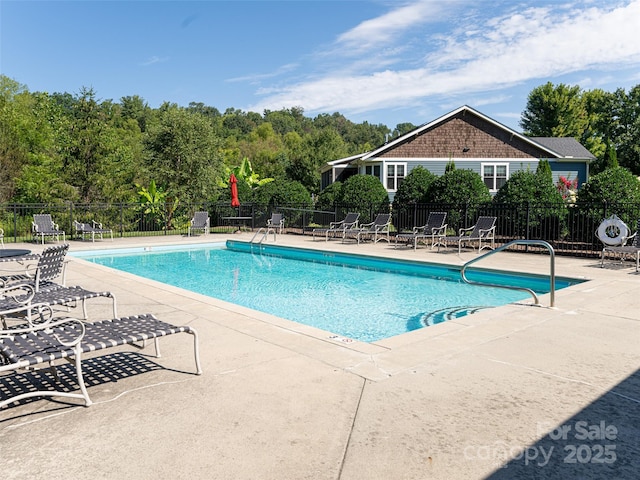 view of pool featuring a patio