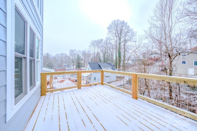 view of snow covered deck