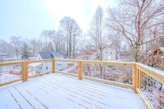 view of snow covered deck