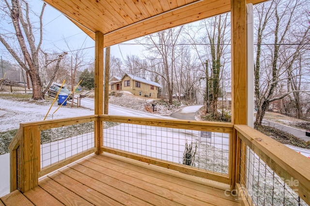 view of snow covered deck