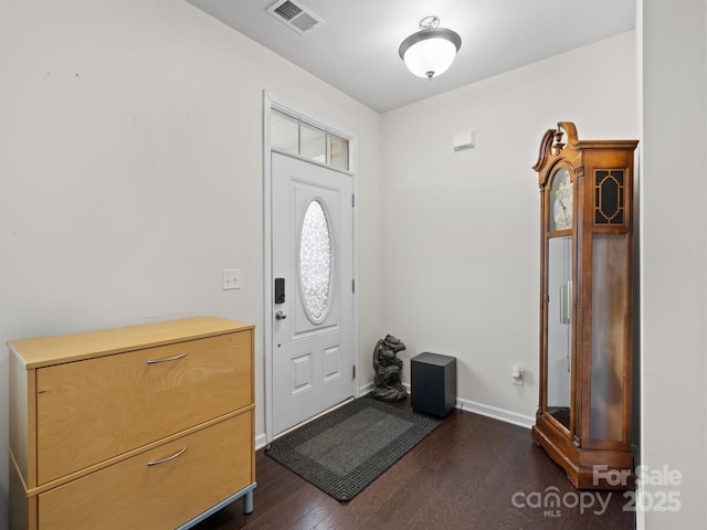 foyer with dark hardwood / wood-style flooring