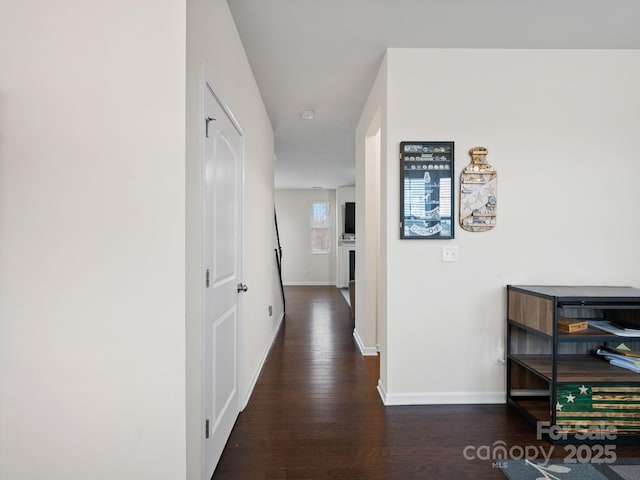 hall with dark hardwood / wood-style floors