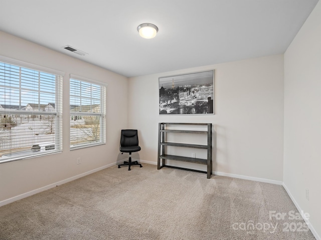 living area with light colored carpet