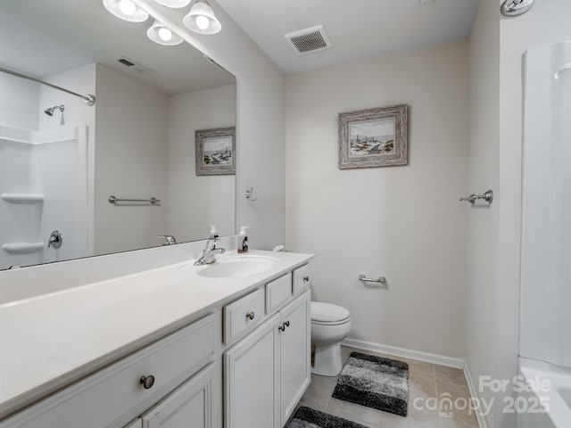 bathroom with a shower, tile patterned flooring, vanity, and toilet