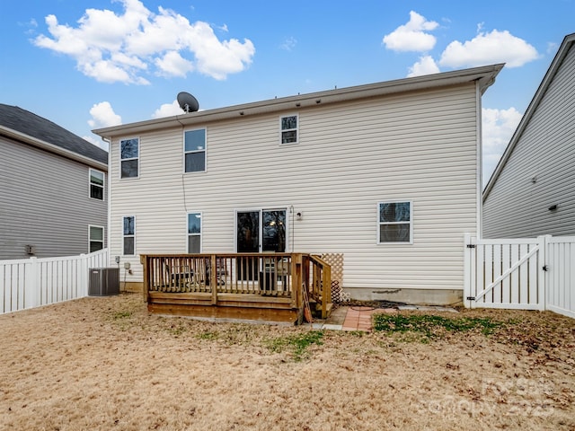 back of property with central air condition unit and a deck