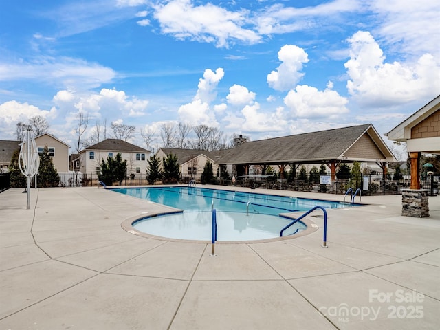 view of swimming pool featuring a gazebo and a patio area