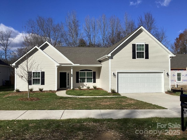 view of front of home featuring a garage and a front lawn