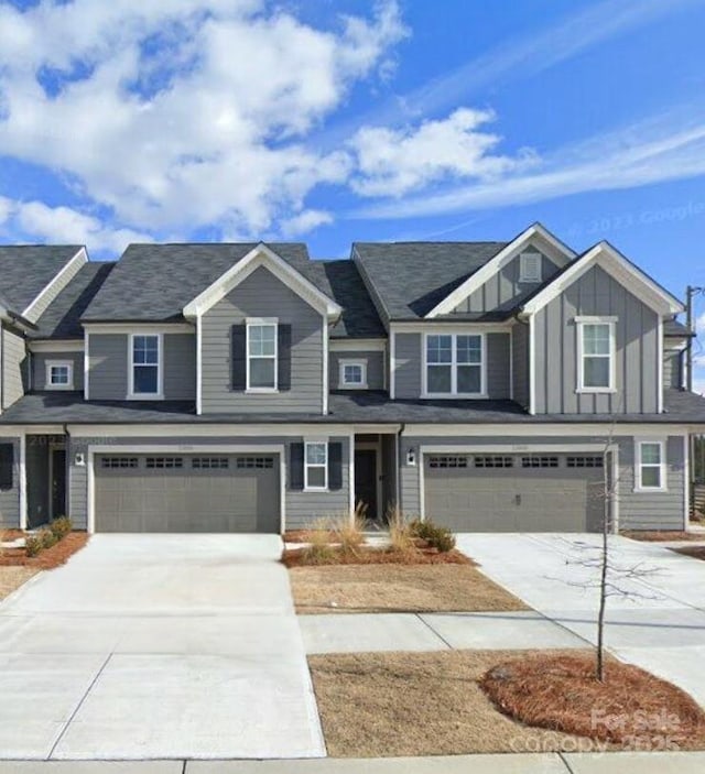 view of front of home featuring driveway, a garage, and board and batten siding