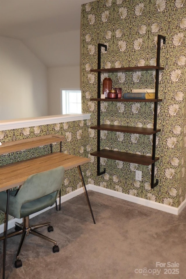 office space featuring carpet flooring, vaulted ceiling, baseboards, and wallpapered walls