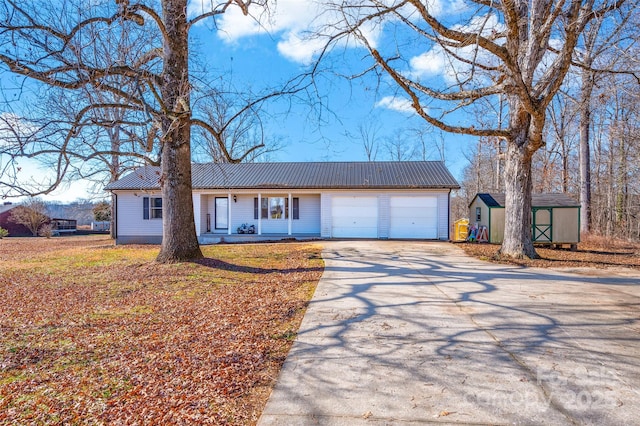 ranch-style home featuring a garage and a storage unit