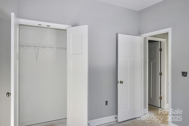 unfurnished bedroom with a closet