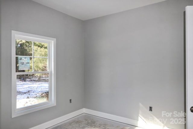 spare room with concrete flooring