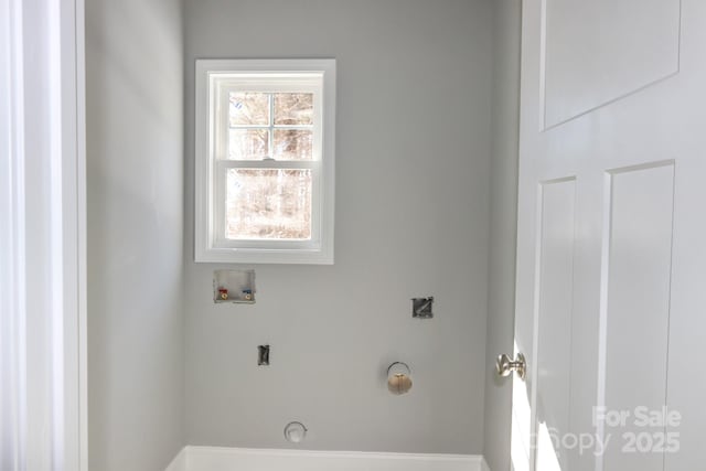 clothes washing area featuring washer hookup and hookup for an electric dryer