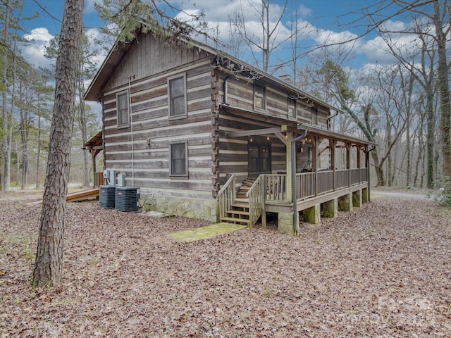 view of side of property featuring central AC