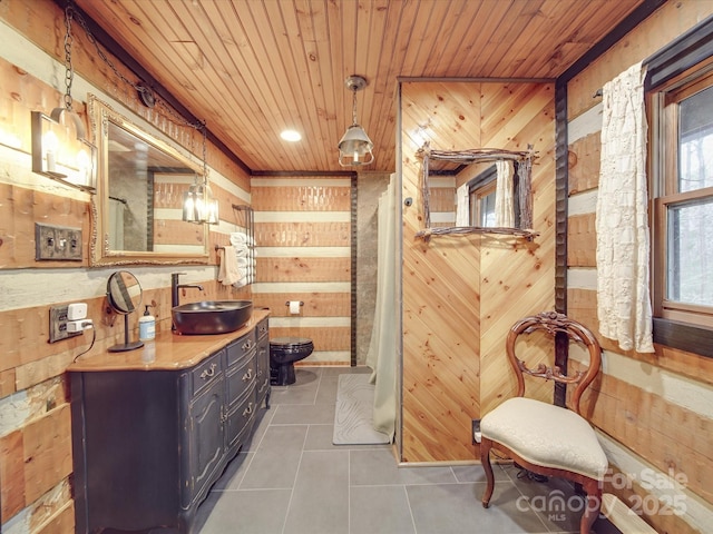 interior space featuring tile patterned flooring, wood ceiling, toilet, and wood walls