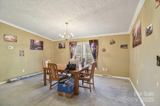 dining space with ornamental molding, a textured ceiling, carpet, and a notable chandelier