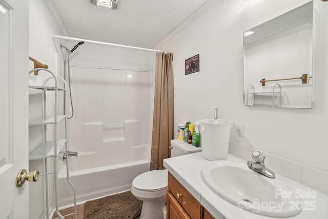 full bathroom featuring shower / bath combo, vanity, and toilet