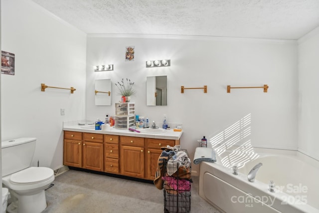 bathroom featuring crown molding, vanity, a textured ceiling, and a tub