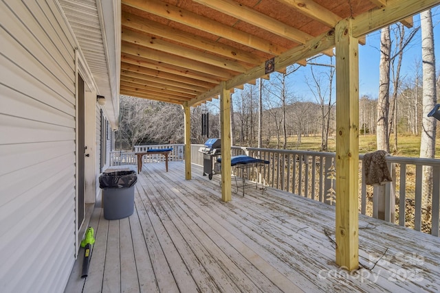 wooden deck with grilling area