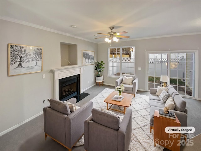 living room featuring carpet flooring, ceiling fan, and crown molding