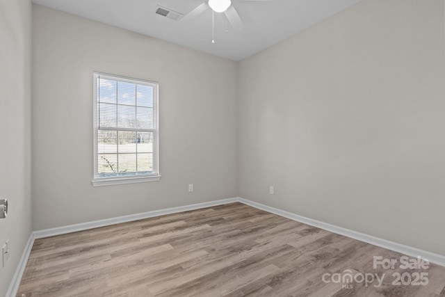 unfurnished room featuring ceiling fan and light hardwood / wood-style flooring