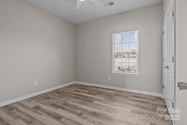 empty room with light hardwood / wood-style floors