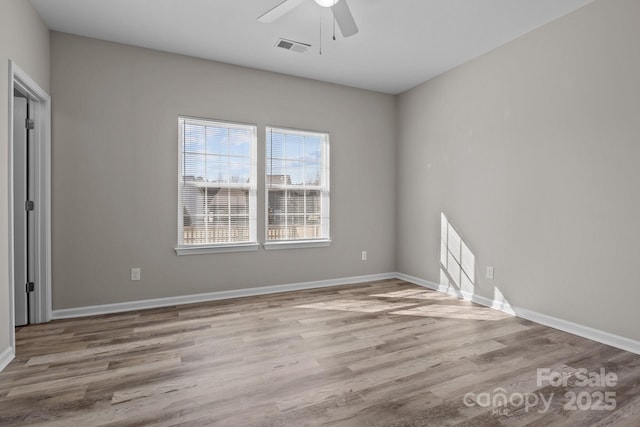 unfurnished room featuring ceiling fan and light hardwood / wood-style flooring