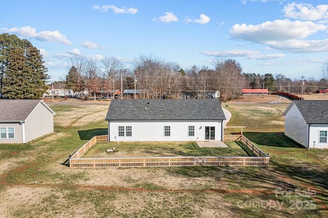 back of house featuring a patio area and a yard