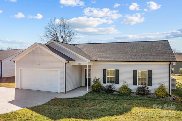 single story home with cooling unit, a garage, and a front lawn