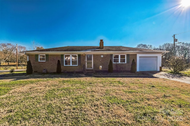 single story home with a garage and a front yard