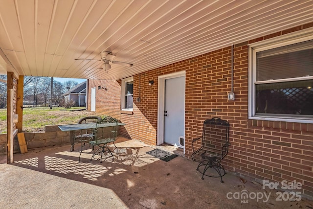 view of patio featuring ceiling fan