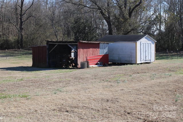 view of outbuilding featuring a yard