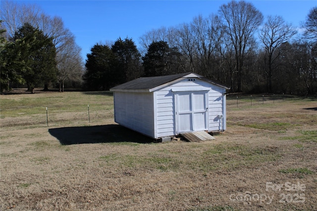 view of outdoor structure with a lawn